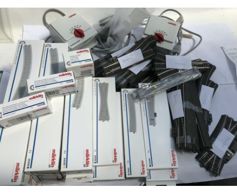 Marklin railway, HO scale , Track boxed and loose, also includes 2x Marklin controllers also 6 tins of loose rails, unrun, MI