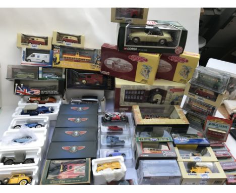 A collection of boxed diecast vehicles including Corgi, Lledo ec