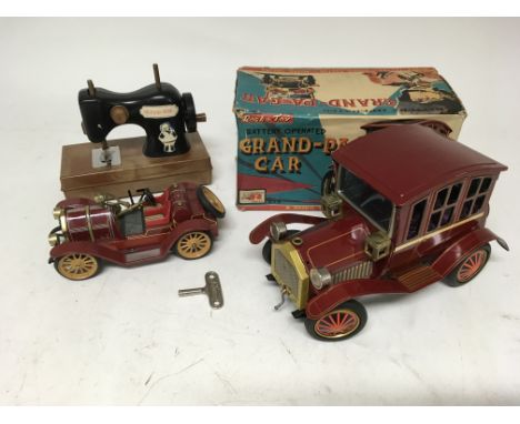 Schuco tin plate car, clockwork with key, a boxed Battery operated Grand pa car by Roscoe toys and a Victoria Rose Childs sew