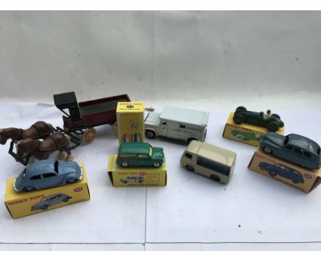 A collection of diecast vehicles including an Ertl horse and car, Atlas Dinky Volkswagen #181, Morris Mini traveller #197, Es