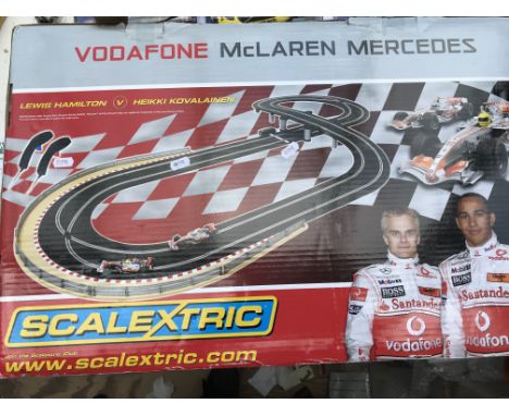 A boxed Scalextric, Lewis Hamilton V Heikki Kovalainen, Vodaphone McLaren Mercedes set