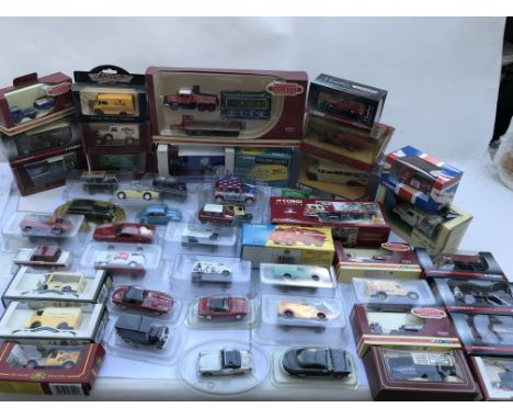 A collection of boxed diecast vehicles including Corgi, Lledo, Matchbox etc