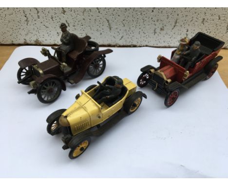 Old lead veteran car with two Britains figures, Yellow plastic bullnose Morris with figure and a red Model T Ford with two fi