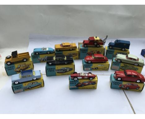 A collection of boxed vintage Corgi vehicles, including Land Rover #406, Mercedes 300SL #303, Chevrolet taxi #221, Land Rover