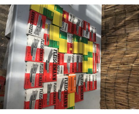A collection of boxed Fleischmann and Minitrix N gauge track