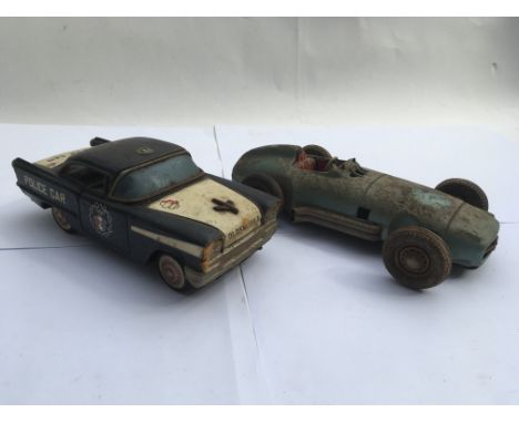 Tinplate friction drive Oldsmobile police car and a  Mercedes tinplate friction drive racing car , made in west Germany