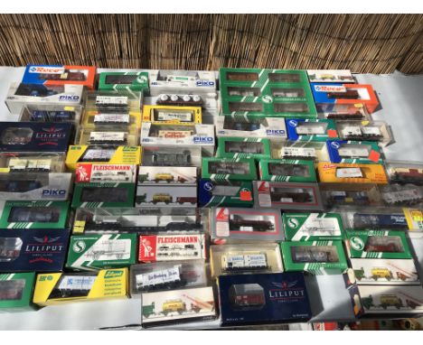 A collection of boxed HO/OO railway rolling stock, including Piko, Lilliput, Fleischmann, Roco etc