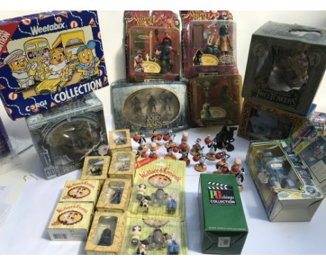 A collection of boxed toys including Muppets, Lord of the rings, Space jam, Wallace and Gromit etc