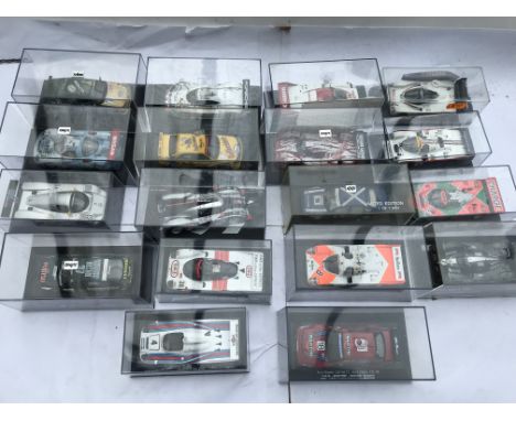 A collection of boxed diecast vehicles including Touring car and Le Mans racing , x18