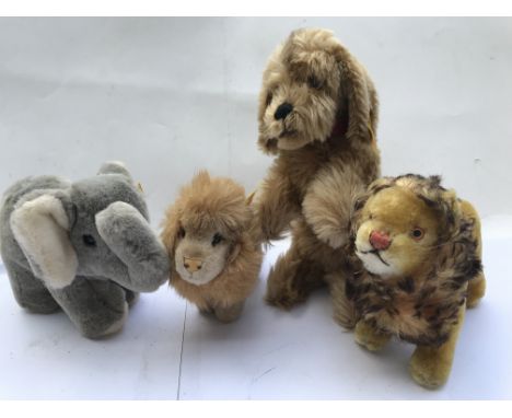 Steiff animals including two lions , a dog and an Elephant, buttons and tags all present