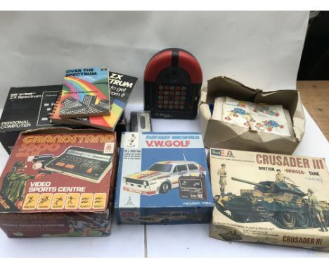 A collection of vintage toys including a Sinclair ZX Spectrum, plastic Meccano,Grandstand 3600 video sports centre, a dolls P