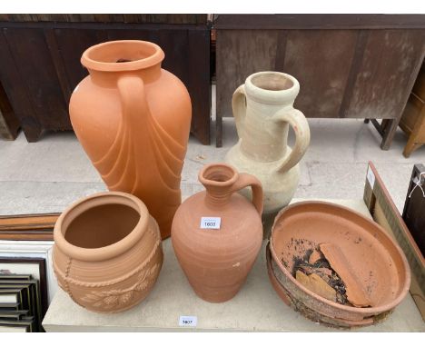 A TERRACOTTA PLANTER, A TERRACOTTA JUG AND TWO TERRACOTTA URNS 