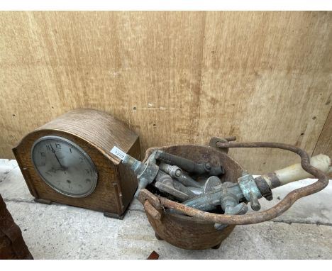 AN OAK CASED MANTLE CLOCK, VINTAGE TAPS AND A CAST PAN 