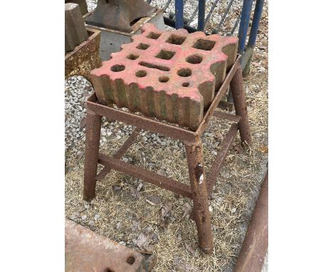 A VINTAGE SWAGE BLOCK ON A STAND 31CM X 31CM 