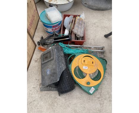 AN ASSORTMENT OF ITEMS TO INCLUDE A WELDING MASK. TILE CUTTERS AND SPIRIT LEVELS ETC 