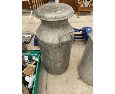 A VINTAGE MILK CHURN 