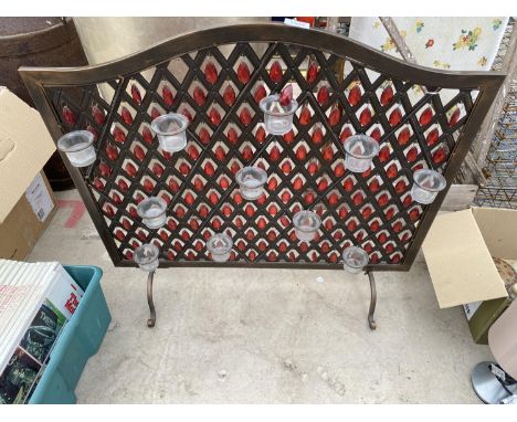 A DECORATIVE FIRE SCREEN WITH RED CRYSTALS AN TEA LIGHT HOLDERS 
