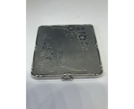 A POSSIBLY SILVER COMPACT WITH MIRROR (ENGRAVED) 