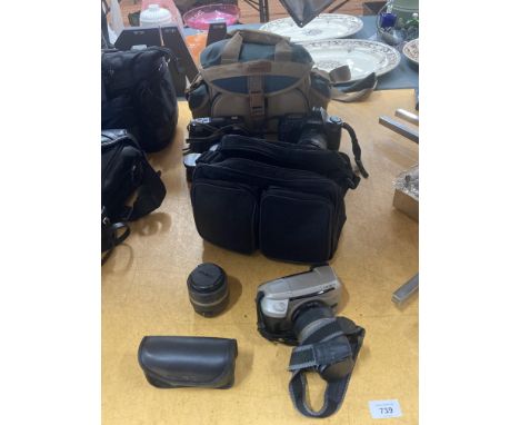 A QUANTITY OF CAMERAS AND CAMERA ACCESSORIES INCLUDING CANON MINOLTA RIOCH, LENSES BAGS LIGHTS ETC. 