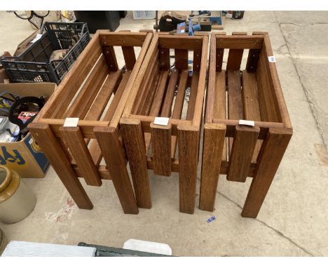 A SET OF THREE WOODEN TROUGH PLANTER HOLDERS 