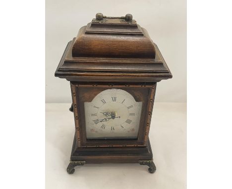A SMALL CUPBOARD DISGUISED AS A MANTLE CLOCK 