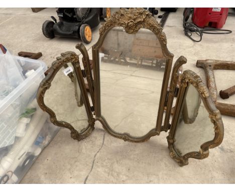 A THREE SECTION GILT FRAMED DRESSING MIRROR 