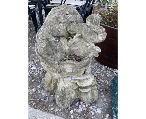 A RECONSTITUTED STONE PLANTER WITH A SQUIRREL DESIGN 