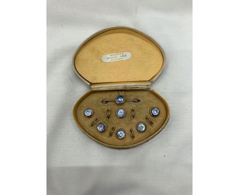 A BOXED SET OF EDWARDIAN ENAMEL STUDS 