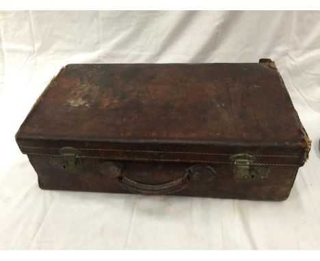 A VINTAGE LEATHER SUITCASE IN NEED OF RESTORATION 
