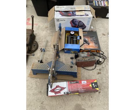 AN ASSORTMENT OF ITEMS TO INCLUDE A SCISSOR JACK, A FOOT PUMP AND A SANDER ETC 
