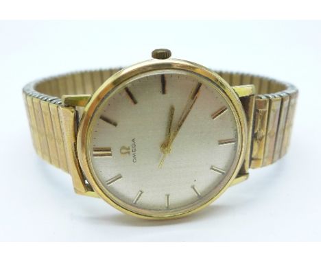 An Omega manual wind wristwatch on an expanding bracelet strap