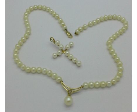 A 9ct gold mounted pearl cross pendant and a 9ct gold mounted pearl necklet