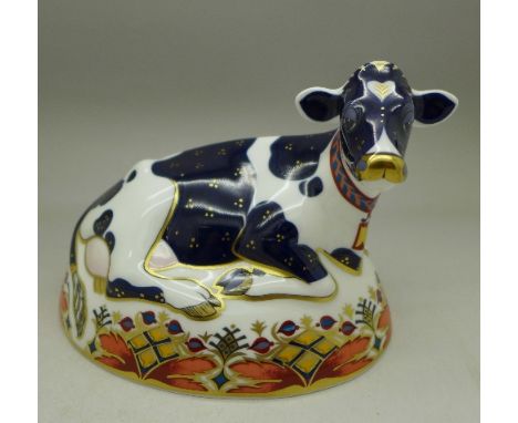 A Royal Crown Derby paperweight, Friesian Cow, Buttercup, with gold stopper, boxed