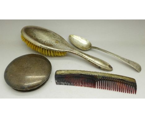 A George IV silver spoon, a silver pot lid, 114g gross, and a silver brush and comb