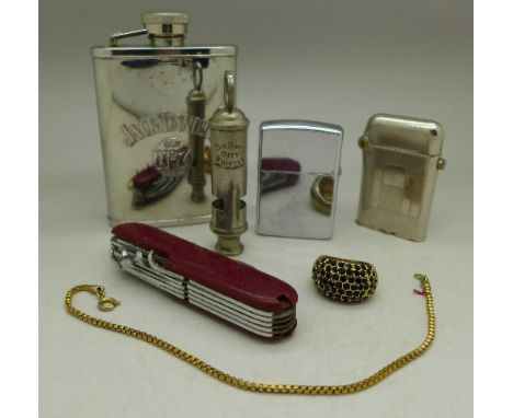 Two lighters, Thorens and Zippo, pen knife, hip flask, whistle, etc.