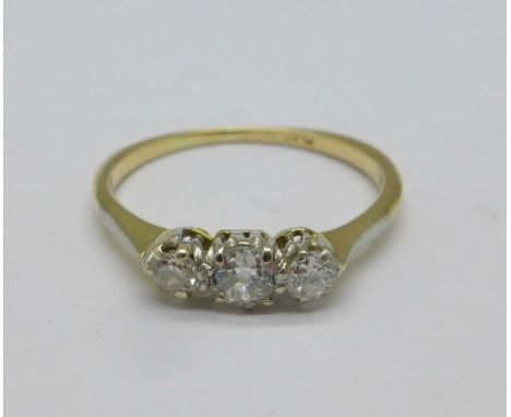 An 18ct gold and platinum set three stone diamond ring, 1.5g, K