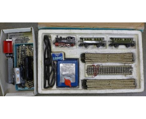 Marklin model rail, boxed plus loose rolling stock and spare track