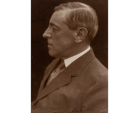 [PRESIDENTS]. A group of presidentially-signed letters and photographs, comprising:WILSON, Woodrow (1856-1924). Three-quarter