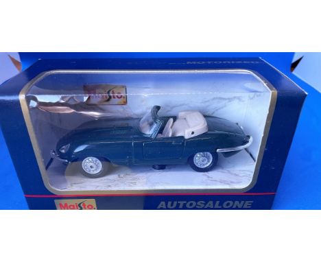 Vintage Toys. Autosalone. Jaguar. A Die-Cast and plastic pull back action car, with opening doors. In original packaging. Min