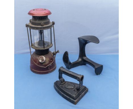 A Tilly lamp, shoe last and flat iron 