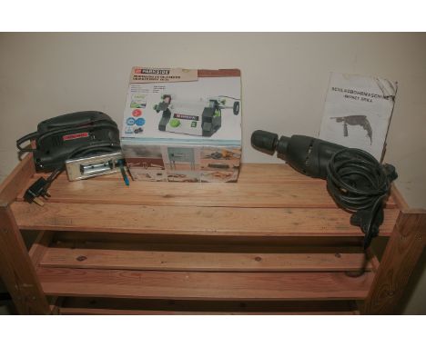 An impact drill together with a modelling double bench grinder and a jigsaw