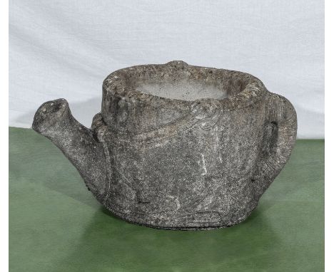 Reconstituted stone garden planter in the form of a watering can