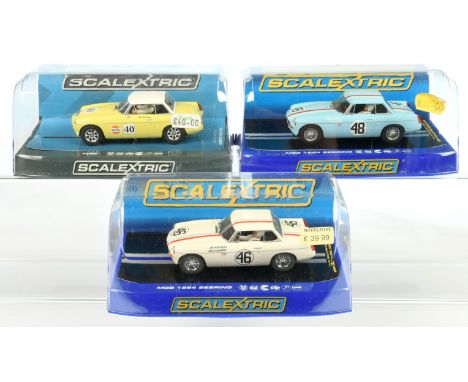 Scalextric MG group (1) C3312 MGB 1964 Sebring - blue RN 48 (2) C3415 Similar - white RN 46 (3) CC3746 MGB Thoroughbred Sport