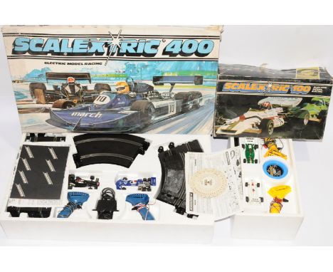 Scalextric, a mixed duo of sets to include, 'Scalextric 100' and 'Scalextric 400'. Both sets seem complete and all parts appe