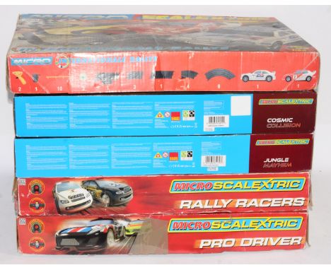 Scalextric, a mixed group of 'Micro-Scalextric' sets to include, 'Pro Driver' set, 'Cosmic Collision' set and others similar.