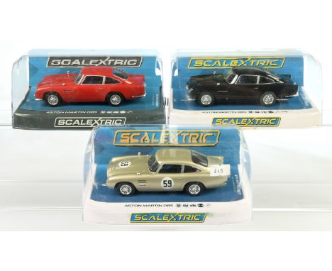 Scalextric Aston Martin DB5 group (1) C4029&nbsp; - Black (2) C722 - Red (3) C4156 - White Gold AMOC Brands Hatch 2019 - Mint