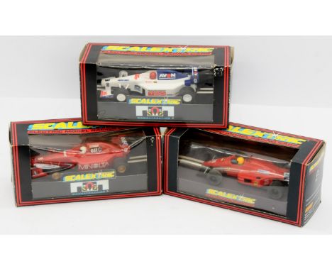 Scalextric, a mixed boxed trio of Slot Cars to include, C.2113 Team Avon, C.457 Ferrari and C.2096 Team Minolta. Conditions g