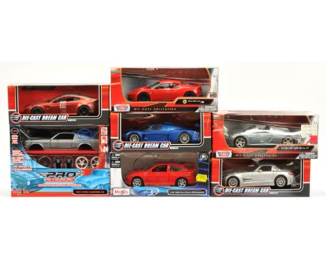 1/24 scale mixed car group to include (1) Motor Max - Lotus Evora S; (2) Motor Max - Porsche Carrera GT; (3) Maisto - 1994 Fo