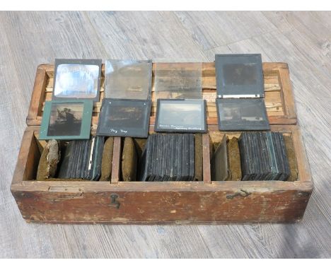 A case of WWI glass magic lantern plates including Zepplins, troops and military scenes