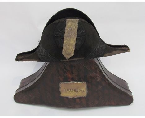 A 19th Century Naval cocked hat with scumbled tin case. The moleskin hat in worn condition with wired strap and button, inter